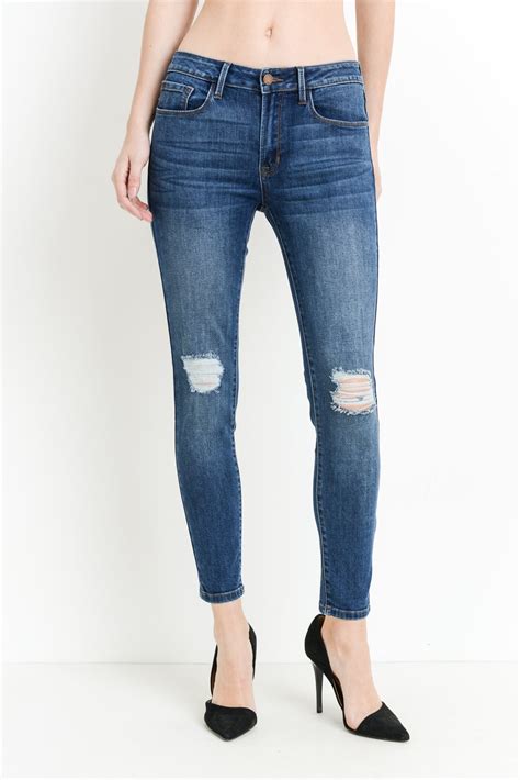 Mid Rise Dark Denim Skinny Jeans With Distressing At Maria Vincent Boutique