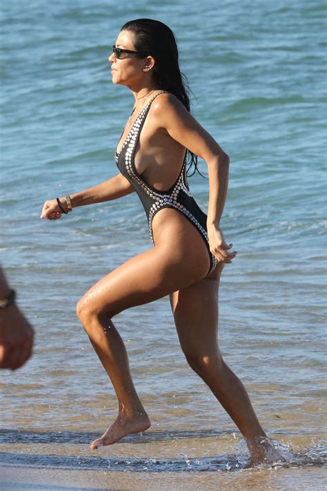 Kourtney Kardashian Shows Off Major Sideboob In A High Cut Swimsuit