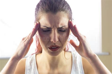 Woman Holding Head Stock Photo Image Of Paining Eyes