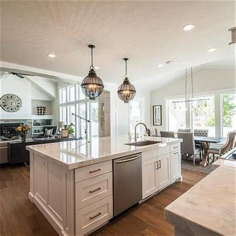 This lovely modern kitchen features a galley layout with a spacious, but not deep island featuring an enormous sink. Kitchen Island with Sinks and Dishwasher