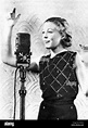 Martha Mears at microphon 1934 Stock Photo - Alamy