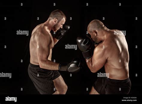 Two Muscular Men Fighting Bodybuilders Punching Each Other Training