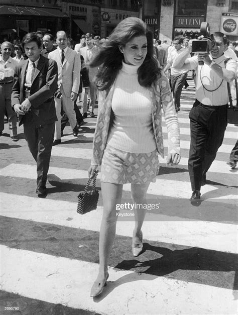 Actress Raquel Welch Strides Across A Zebra Crossing In Spanish News