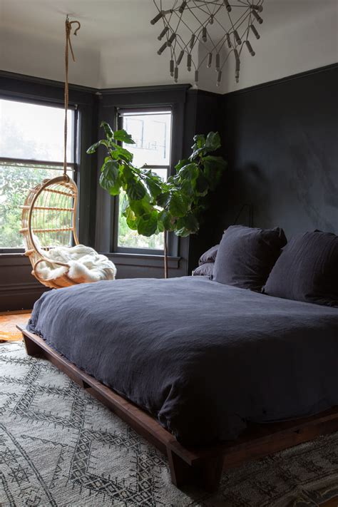 These bedrooms, all with at least one black wall, vary greatly in size and style, but the common denominator is that the black walls are key to the designs' success. Paint a black wall in the bedroom!