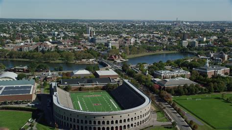 6K stock footage aerial video flying over Harvard Stadium, approach ...