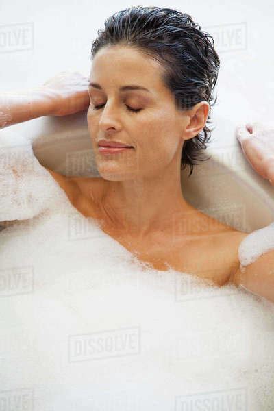 Serene Woman Enjoying Bubble Bath Stock Photo Dissolve