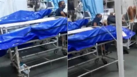 Gruesome Video Shows Bodies Wrapped In Blue Plastic Next To Patients In