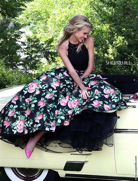a stunning two piece prom dress from sherri hill with lace top and floral skirt poofy prom