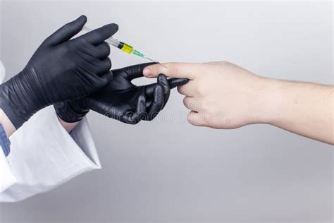 An Orthopedic Surgeon Gives An Injection In The Finger Joint Treatment