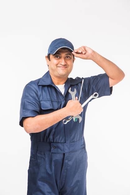 Premium Photo Indian Happy Auto Mechanic In Blue Suit And Cap