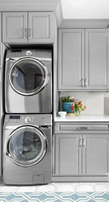 The best design has the automated wardrobelift ® mounted up high with a stationary clothes rail mounted below. stacked washer and dryer with counter and upper cabinet or ...