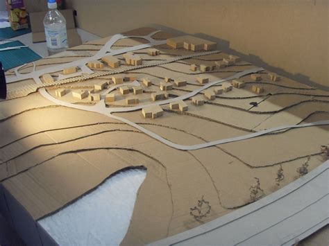 A Model Of A City With Lots Of Buildings And Roads On Its Surface