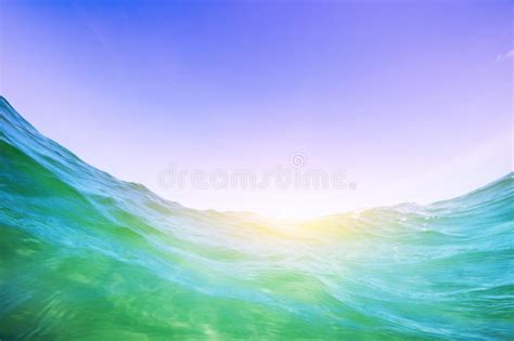 Water Wave In The Ocean Underwater And Blue Sunny Sky Stock Image