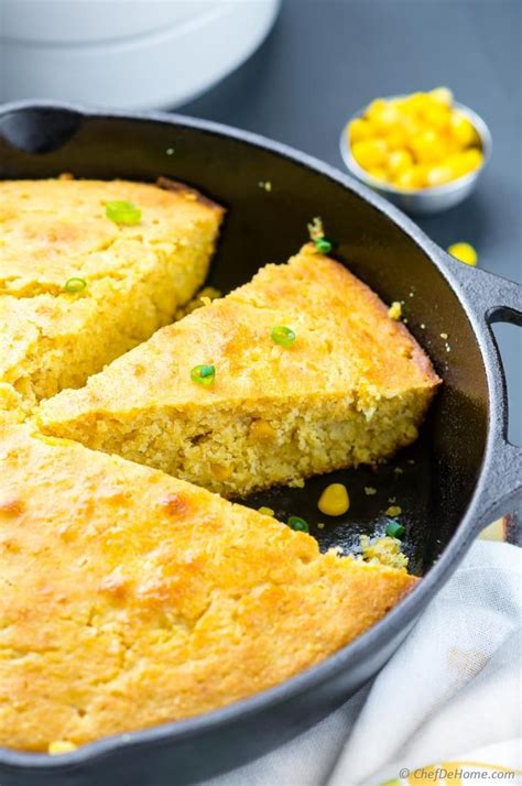 Cornbread In A Skillet With Two Pieces Cut Out