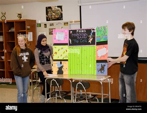 High School Students Giving A Project Presentation In A Classroom Stock