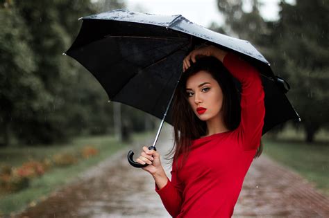 Beautiful Woman In Red Shirt And Umbrella In The Rain