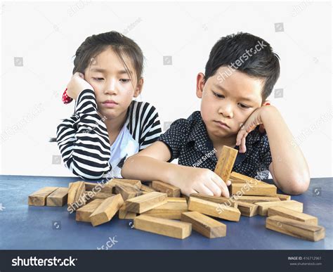 Children Playing Jenga Wood Blocks Tower Foto Stock 416712961