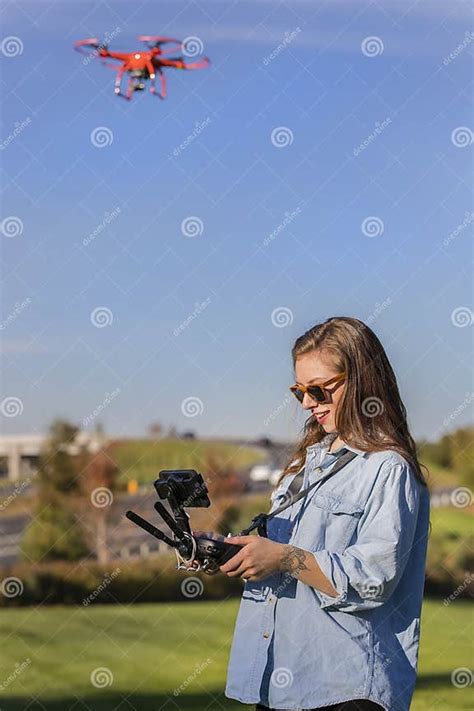 brunette coed flying a drone stock image image of beautiful flying 80054587