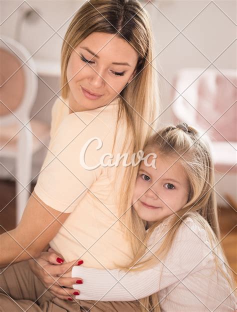 Little Girl Hugging Her Mother Photos By Canva