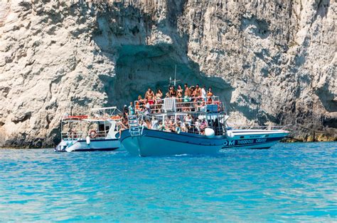 Boats With Tourists At The Blue Caves Of Zakynthos Island Gree