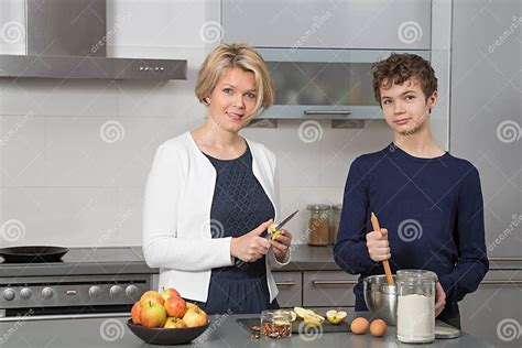 mother and son in the kitchen stock image image of apple european 65173097