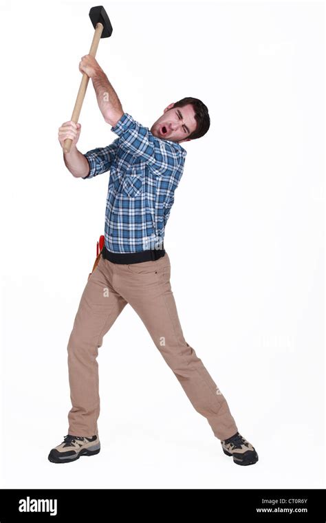 Man Using Sledge Hammer Stock Photo Alamy