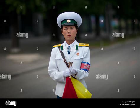 North Korean Female Traffic Security Officer In White Uniform In The