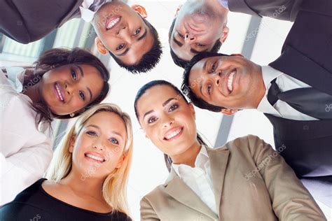 Group Of Business People Looking Down — Stock Photo © Michaeljung 27899437
