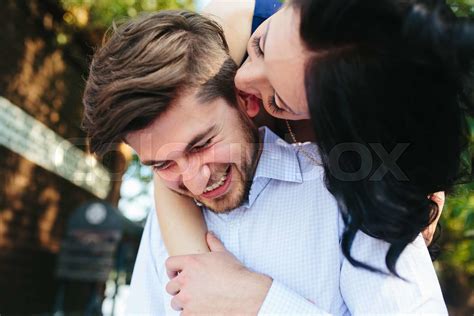 Woman Embracing Her Boyfriend From Behind Stock Image Colourbox