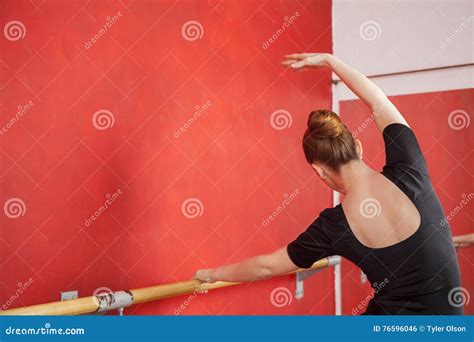 Dancer Stretching At Barre In Ballet Studio Stock Photo Image Of