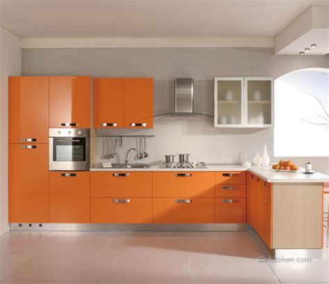 See more pictures of this modern orange kitchen. It's very easy to brighten your kitchen with glossy orange acrylic cabinet