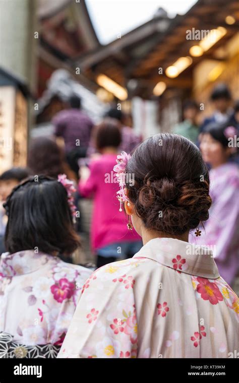 Japanese Women Wear A Traditional Dress Called Kimono For Sakura Viewing At Kiyomizu Temple In