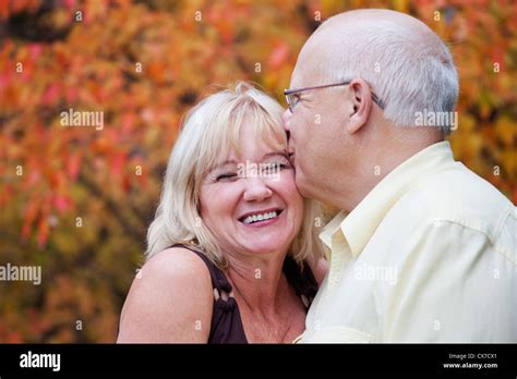 mature married couple enjoying spending time together in park during fall season edmonton