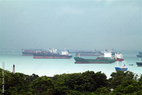 Landscape From Bird View Of Cargo Ships Entering One Of The Busiest