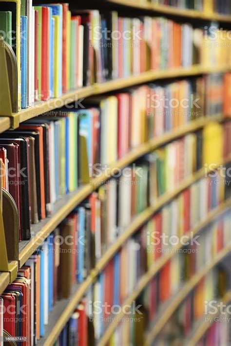 Library Books On Rows Of Shelves Stock Photo Download