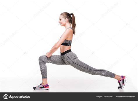 Sporty Woman Stretching Legs — Stock Photo © Allaserebrina 167952300