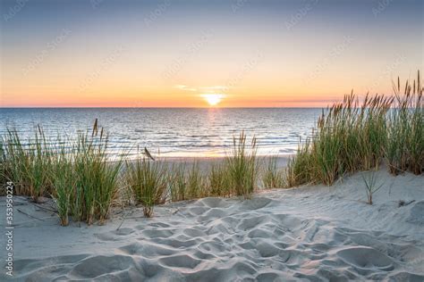 Fotobehang Sunset At The Dune Beach Foto4art