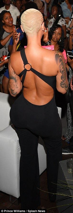 Amber Rose Displays Her Curvaceous Derriere In Skintight Black Jumpsuit