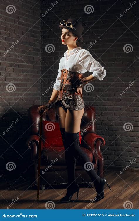 Portrait Of A Beautiful Steampunk Girl In Lingerie And Stockings Hat