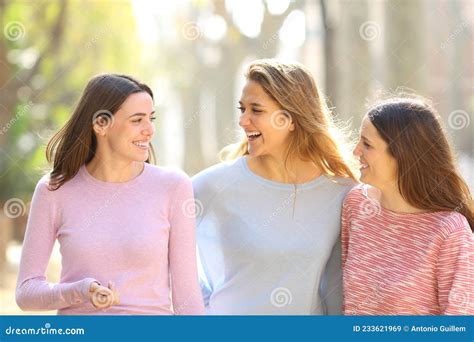 Three Friends Talking Walking In The Street Stock Image Image Of Communication Interacting