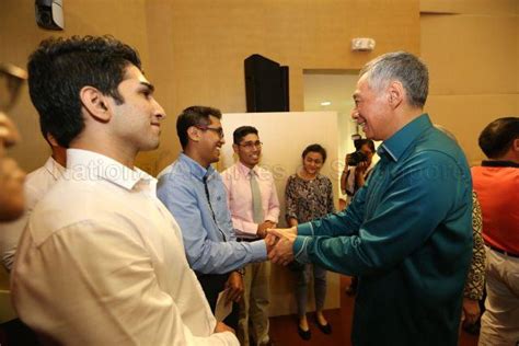 Prime Minister Lee Hsien Loong Interacting With Young Malay