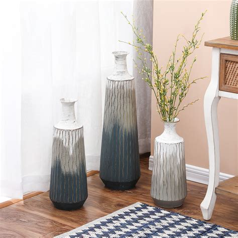 This Lovely Vase Set Is Handcrafted Iron In A Mixtures Of Gray And White With Gold Highlights