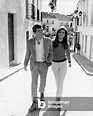 Patrick Curtis and Raquel Welch walking around Malaga, 1966 (b/w photo)