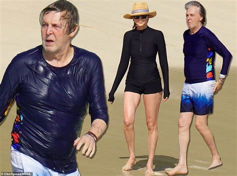 Sprightly Paul Mccartney 79 Hits The Beach And Dives Into Waves Daily Mail Online