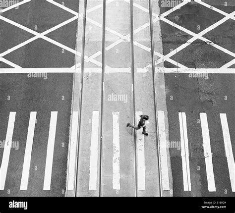 Overhead View Of Man Running Across The Street Stock Photo Alamy