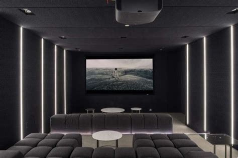 This Contemporary Home Has A Dark Home Theatre Room With Comfortable