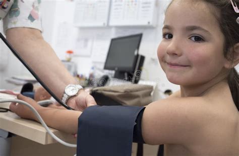 Little Girl Being Giving Blood Pressure Test Doctor Stock Image Image