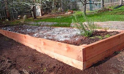 Start by digging out the soil to create a flat surface. How to build a raised garden bed on sloping, uneven ground ...