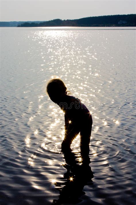 Child Swimming In The Lake In Sunny Track Light Stock Photo Image Of