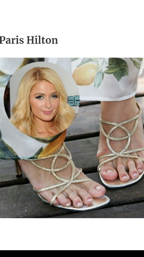 A Womans Feet Wearing White Sandals